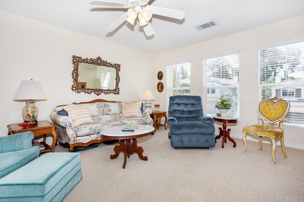 5560 Foxtail Loop Carlsbad, CA 92010 - Photo 22 of 32 a living room with furniture and a flat screen tv