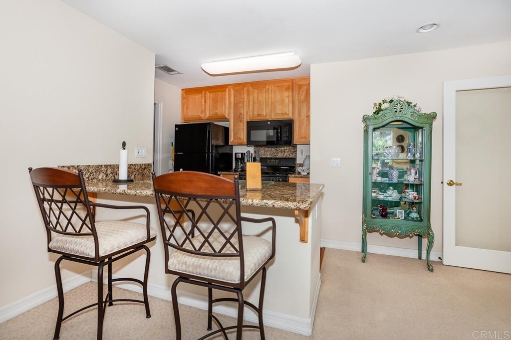 5560 Foxtail Loop Carlsbad, CA 92010 - Photo 23 of 32 a dining room with furniture and window