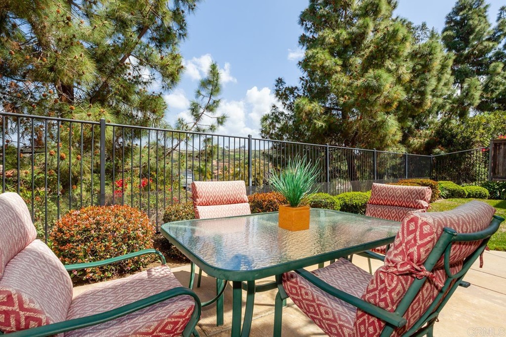 5560 Foxtail Loop Carlsbad, CA 92010 - Photo 29 of 32 a view of a balcony with two chairs and a table