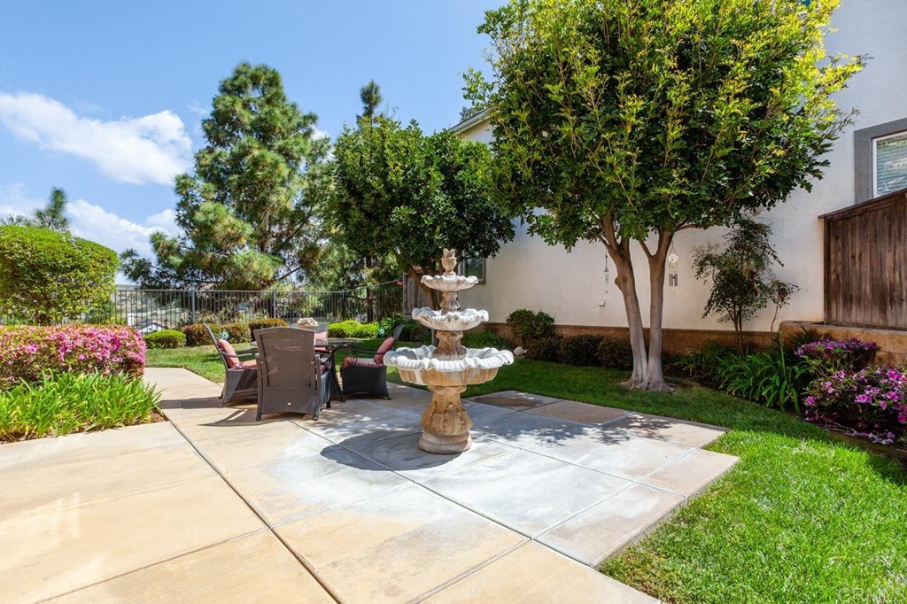 5560 Foxtail Loop Carlsbad, CA 92010 - Photo 30 of 32 a view of a backyard with garden and plants