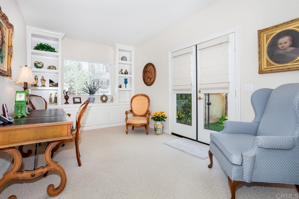 5560 Foxtail Loop Carlsbad, CA 92010 - Photo 3 of 32 a living room with furniture and a clock