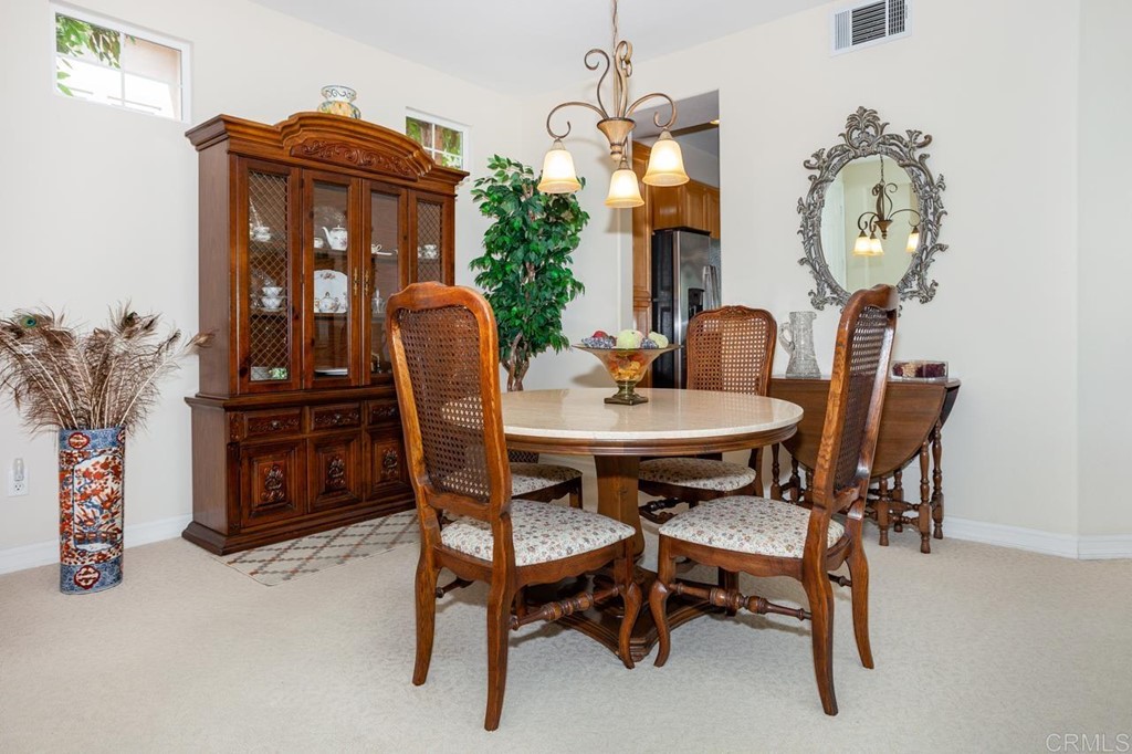 5560 Foxtail Loop Carlsbad, CA 92010 - Photo 7 of 32 a dining room with furniture and window