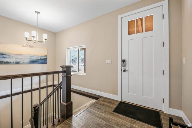 4527 North Seven Bridges Road Eden, UT 84310 - Photo 9 of 65 Foyer entrance with dark wood finished floors and a chandelier