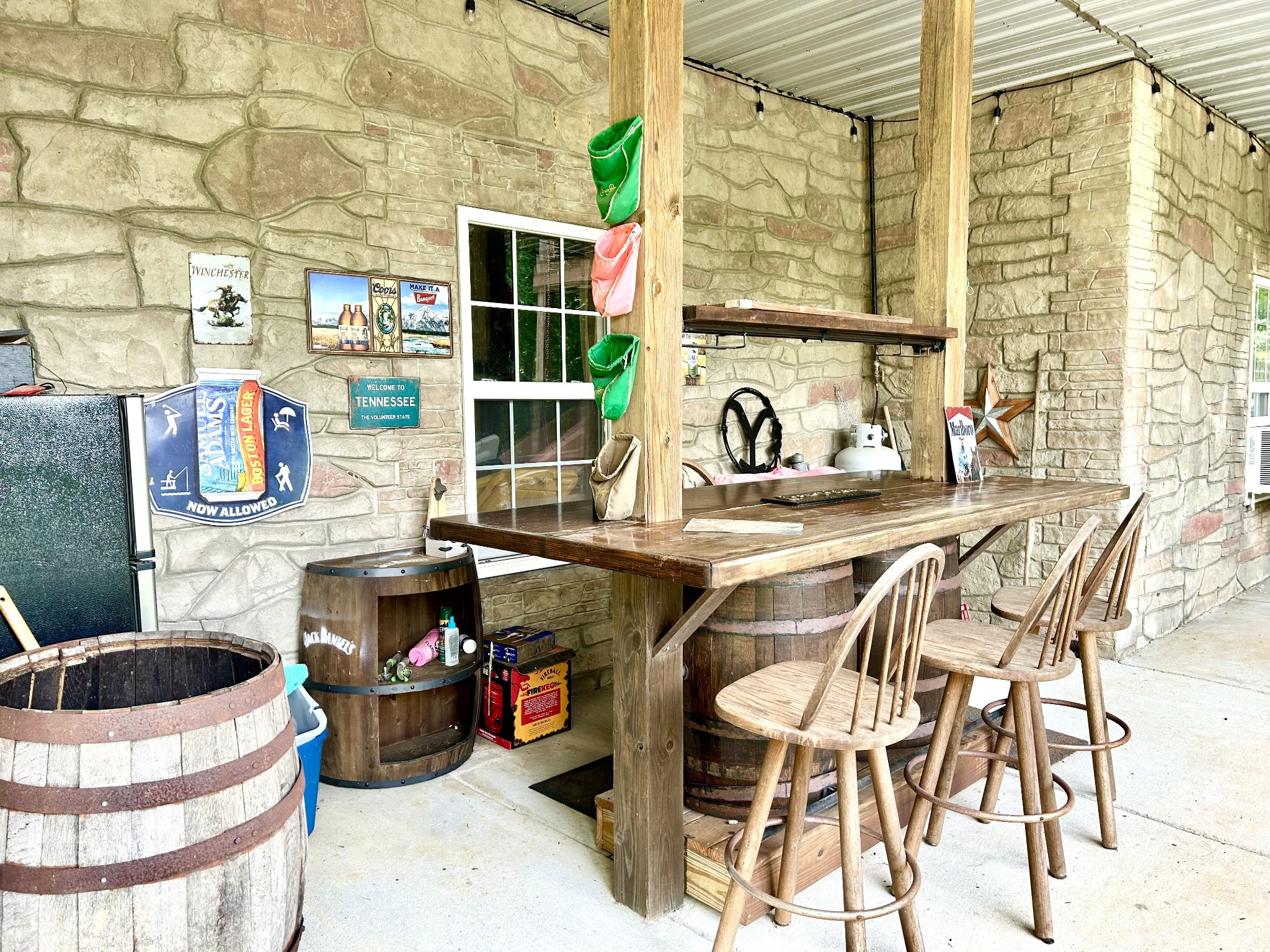 1198 Ed Sanders Road Lynchburg, TN 37352 - Photo 35 of 36 a dinning table and chairs in front of a building