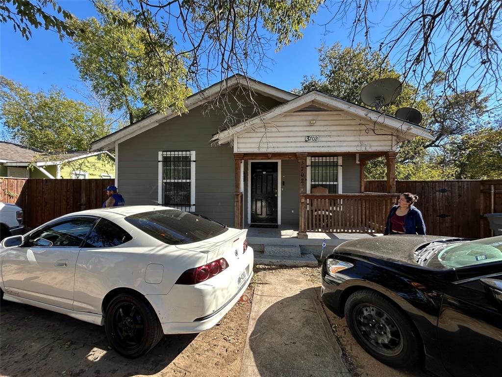 a view of a car parked in front of house