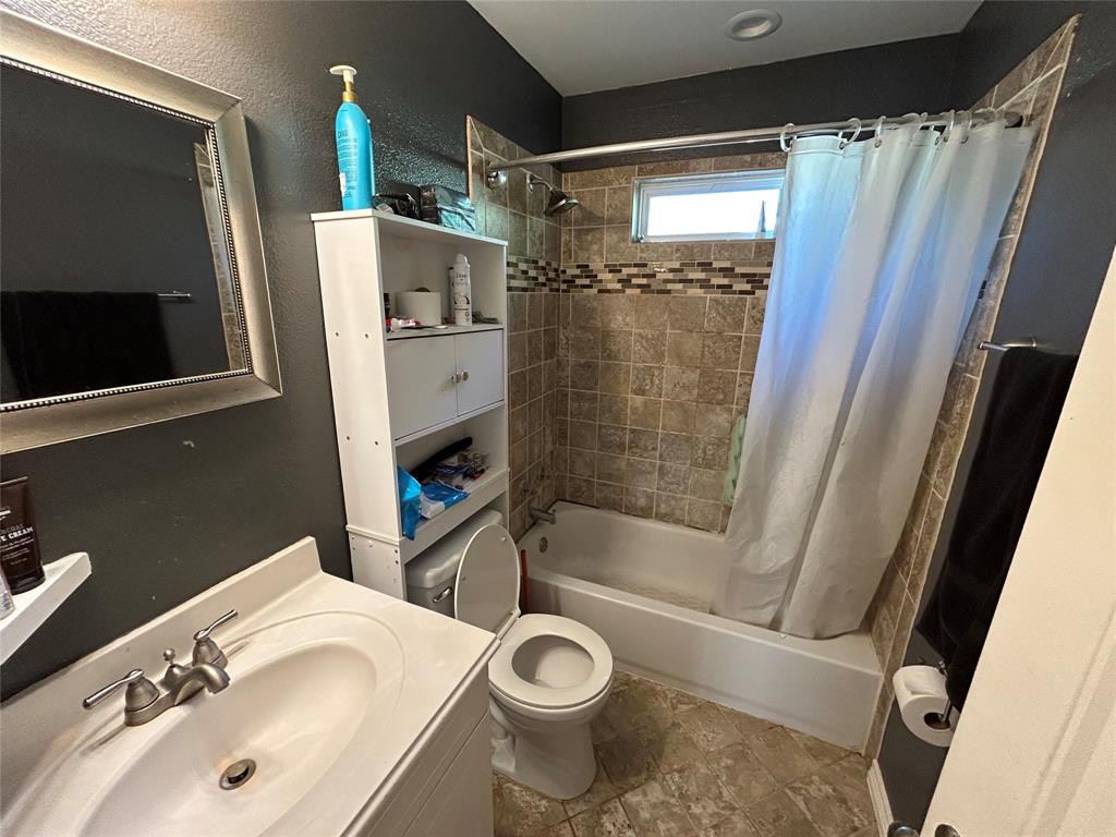 3702 Frank Street Dallas, TX 75210 - Photo 5 of 8 a bathroom with a sink toilet and shower