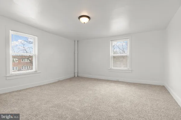 an empty room with windows