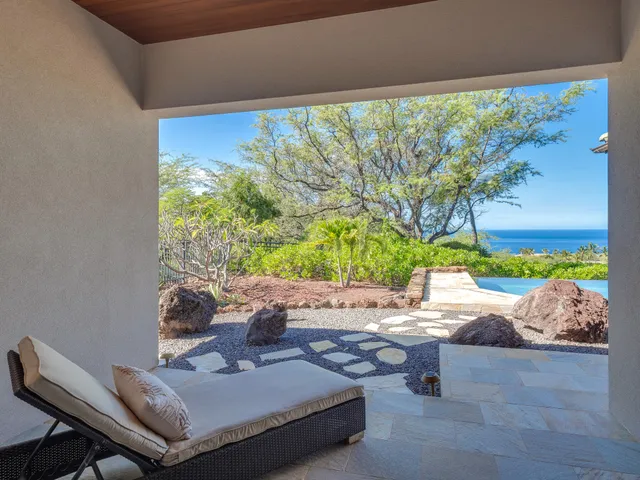 a view of backyard with a table and chairs