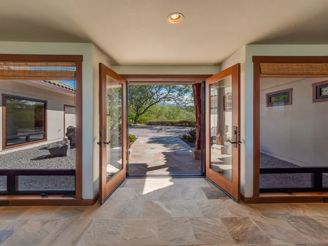 a view of an entryway with bedroom and balcony