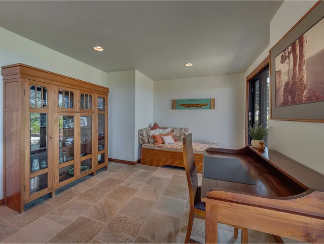 a bedroom with furniture and window