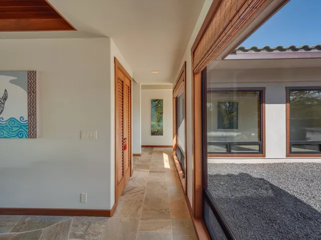 a view of a hallway view with staircase