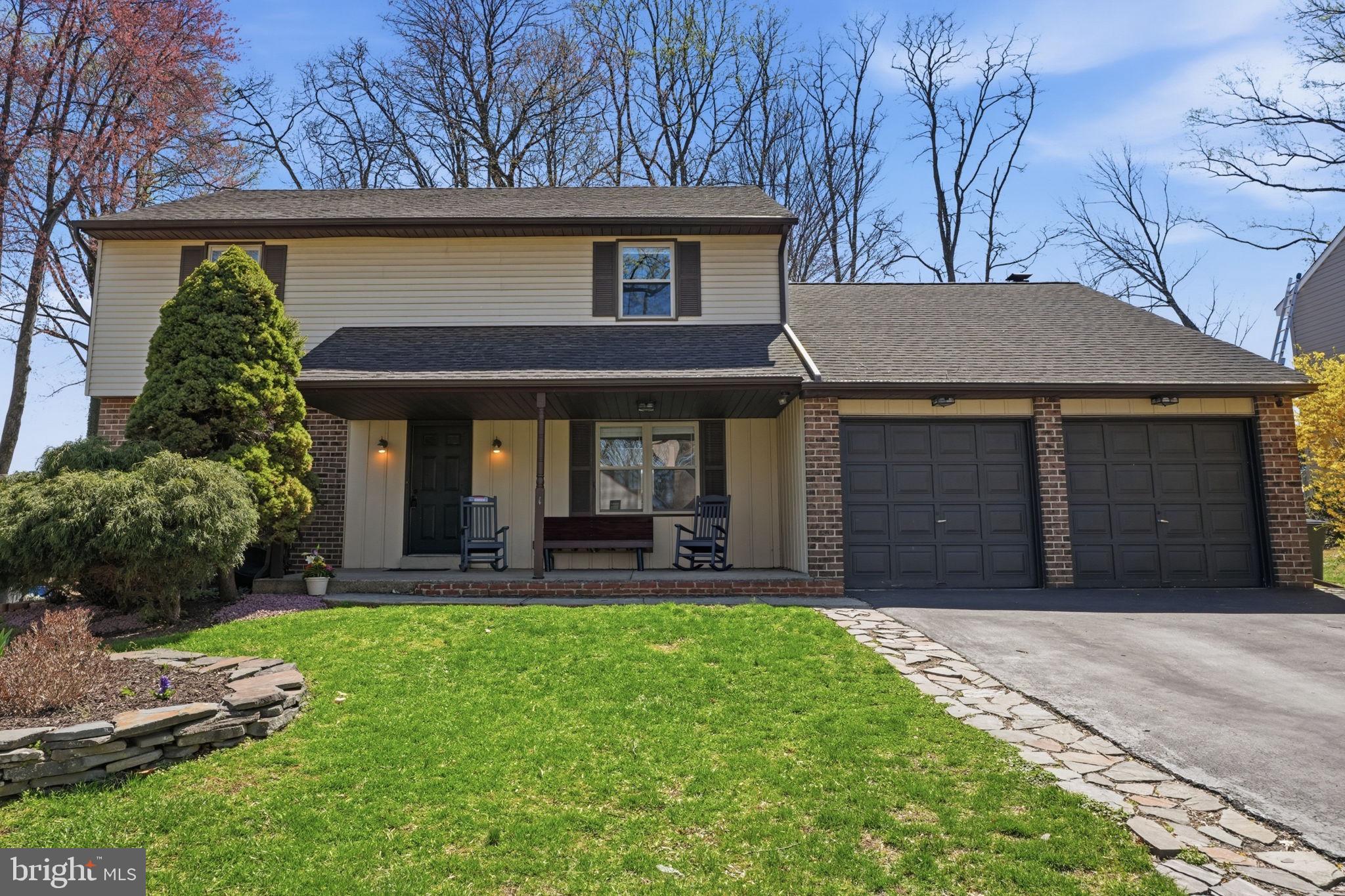 739 Bridgeview Road Feasterville-Trevose, PA 19053 - Photo 2 of 46 a front view of a house with a yard table and chairs