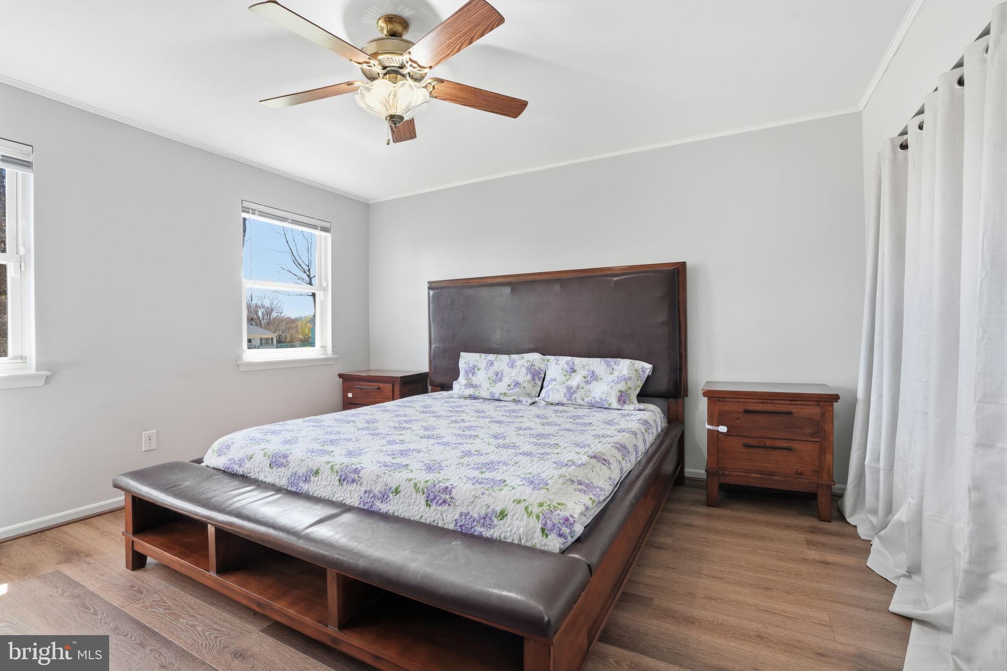 739 Bridgeview Road Feasterville-Trevose, PA 19053 - Photo 23 of 46 a bedroom with a bed and a chandelier