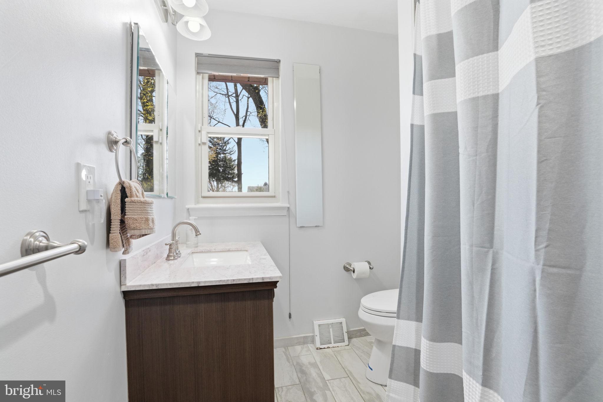 739 Bridgeview Road Feasterville-Trevose, PA 19053 - Photo 28 of 46 a bathroom with a sink and a mirror