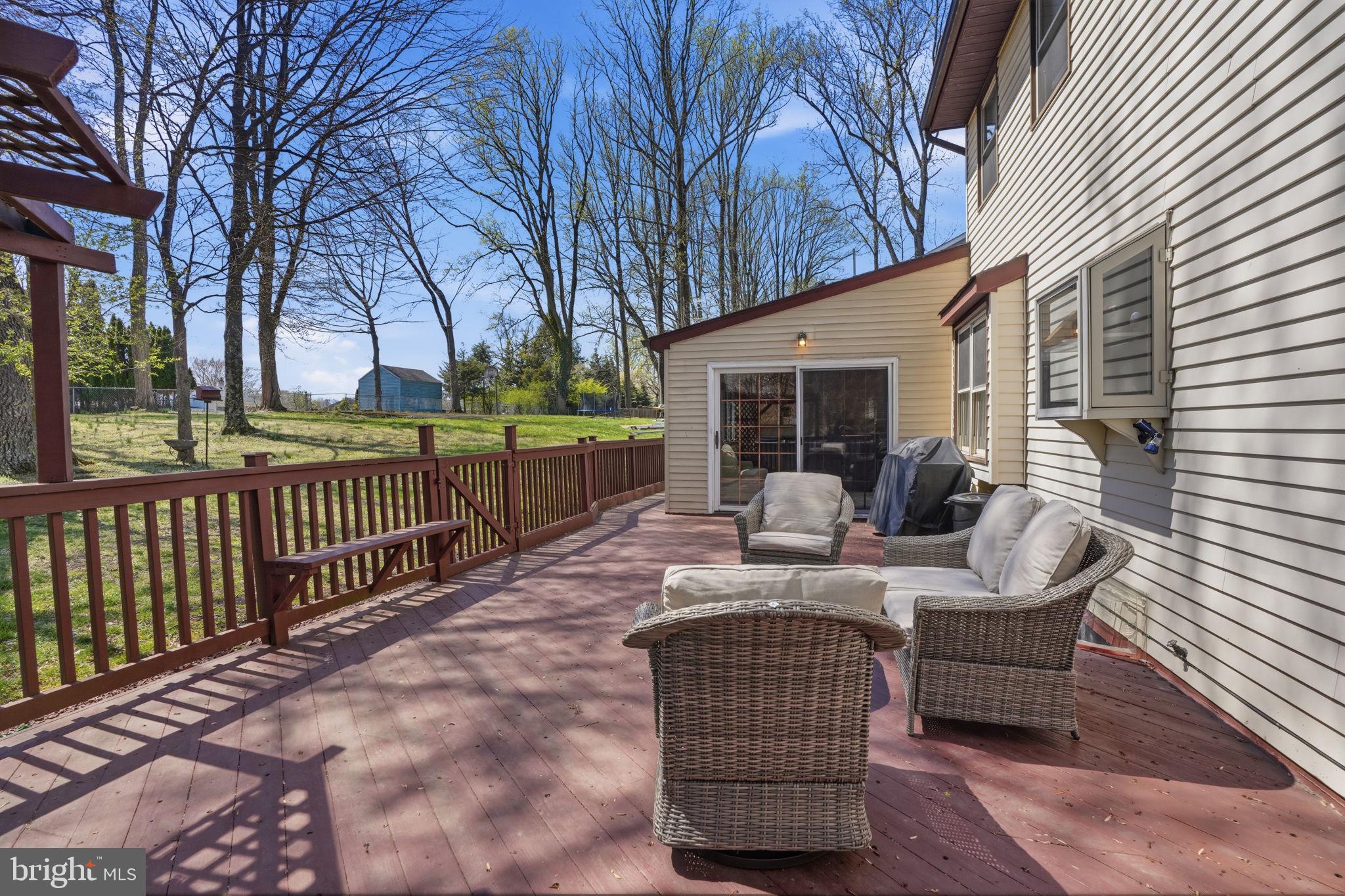 739 Bridgeview Road Feasterville-Trevose, PA 19053 - Photo 31 of 46 a view of a patio with couches chairs and wooden fence