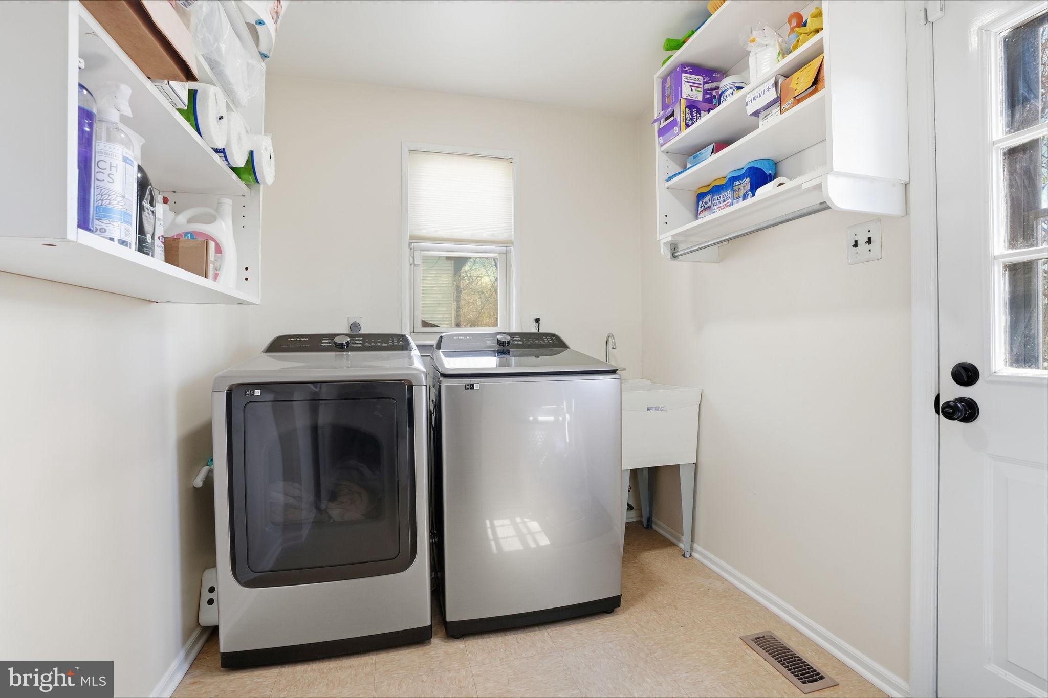 739 Bridgeview Road Feasterville-Trevose, PA 19053 - Photo 9 of 46 a utility room with washer and dryer