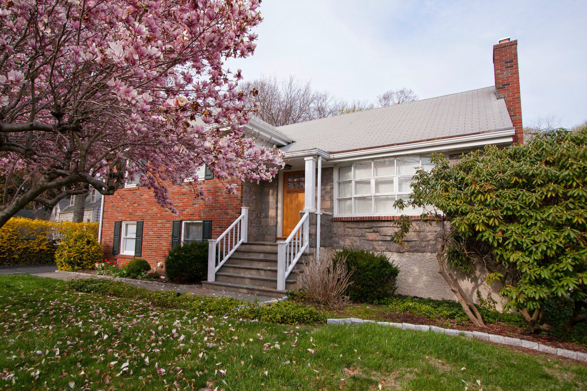 41 Indian Field Road Greenwich, CT 06830 - Photo 1 of 20 a front view of a house with a yard