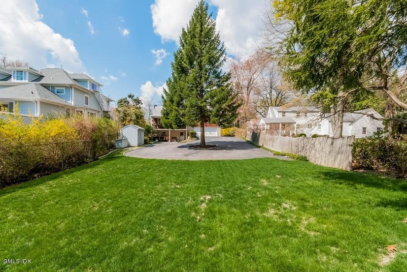 41 Indian Field Road Greenwich, CT 06830 - Photo 17 of 20 a view of a house with patio and garden