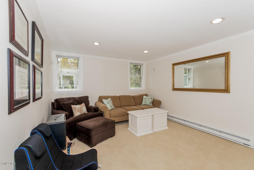 41 Indian Field Road Greenwich, CT 06830 - Photo 9 of 20 a living room with furniture and a window