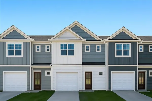 a front view of a house with yard
