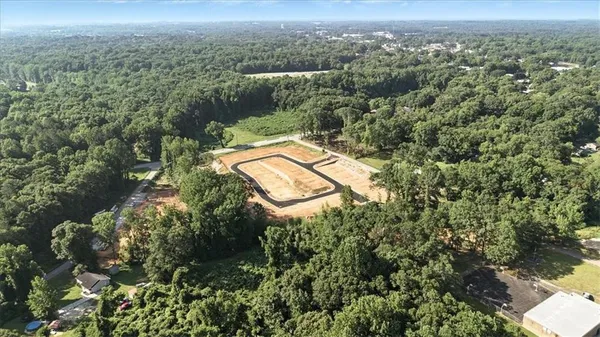 an aerial view of a house with a yard