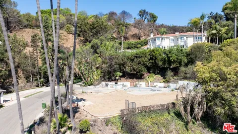 a view of a backyard of the house
