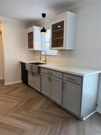 a kitchen with sink and microwave