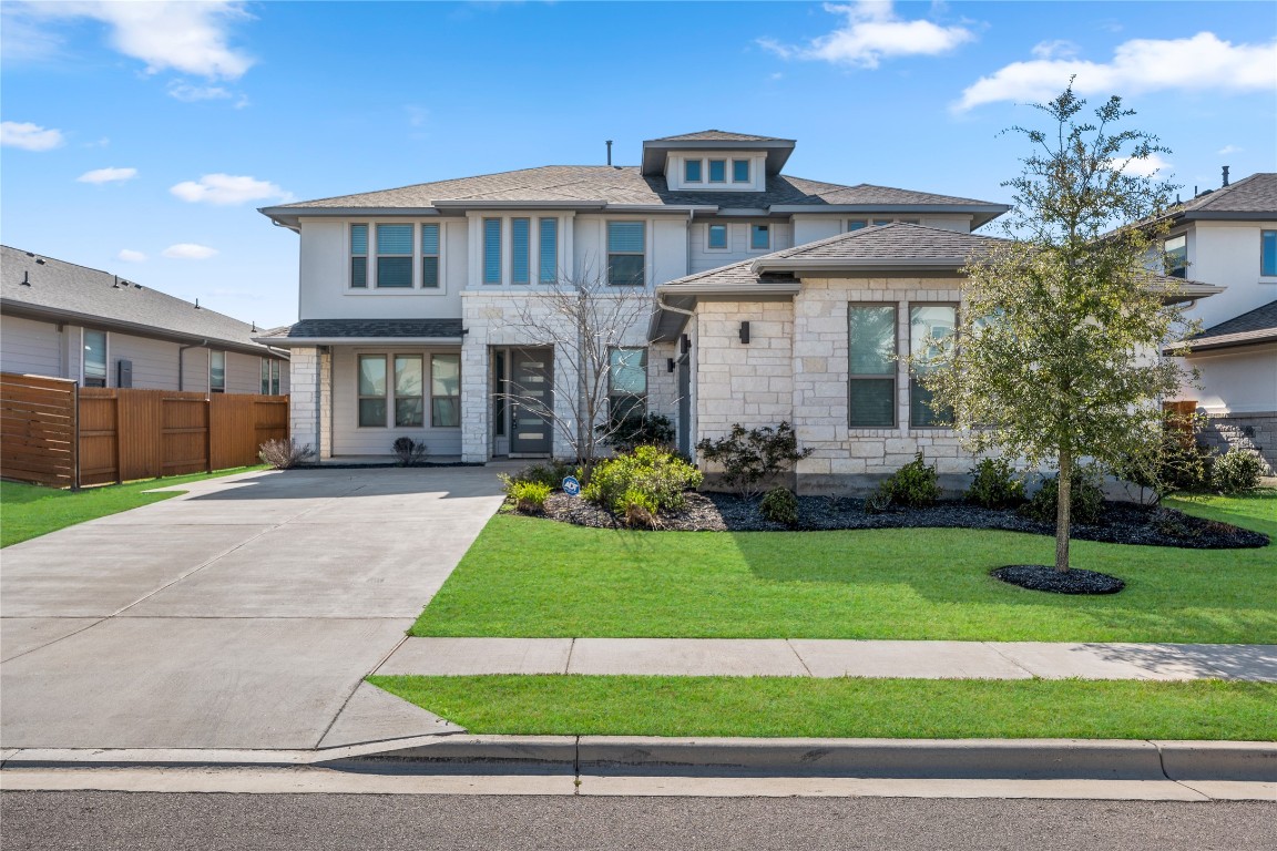 8200 Spire View Austin, TX 78744 - Photo 1 of 1 a front view of a house with a yard