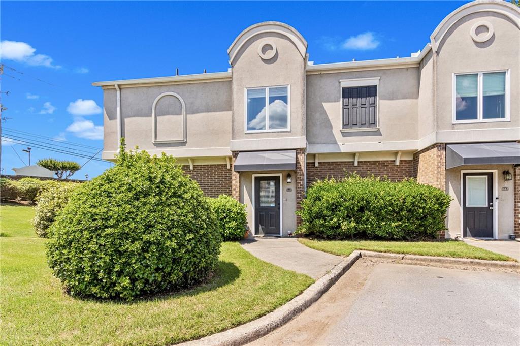 3301 Henderson Mill Road, Unit AA1 Atlanta, GA 30341 - Photo 1 of 1 a front view of a house with garden