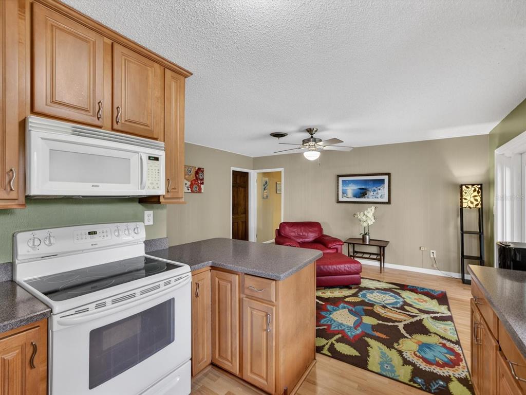2803 Banchory Road Winter Park, FL 32792 - Photo 9 of 31 a kitchen that has a stove and a microwave