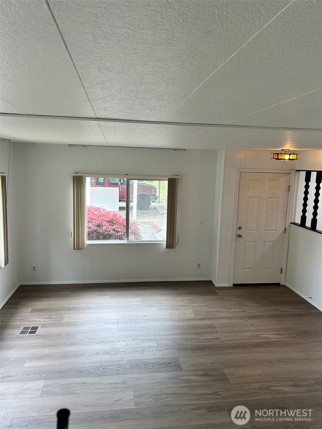 791 Elliot Court Sequim, WA 98382 - Photo 14 of 37 a view of room with window and wooden floor