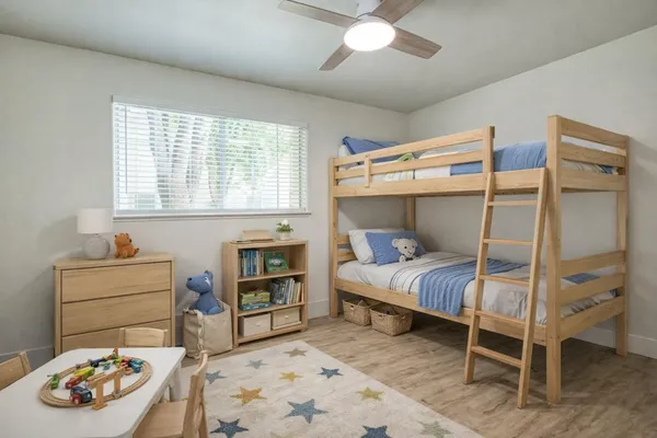 a bedroom with a bed and a window