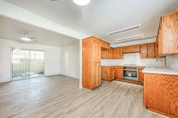 a view of a kitchen with a sink and a window