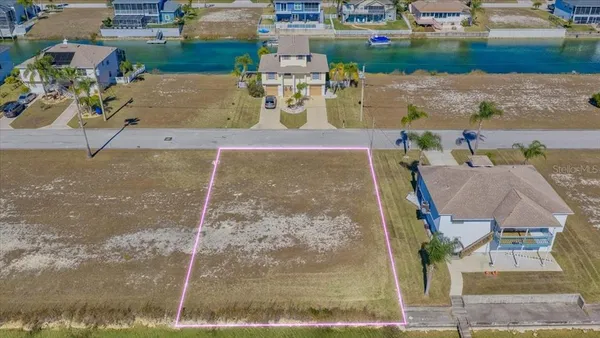 an aerial view of a house with outdoor space