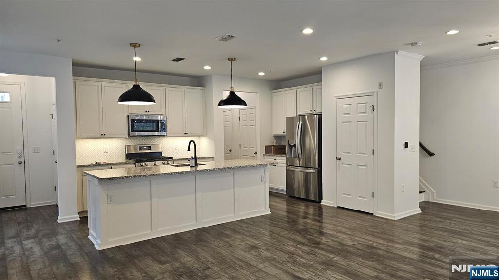 188 Aspen Drive, Unit 414 Cedar Grove, NJ 07009 - Photo 1 of 23 a kitchen with stainless steel appliances granite countertop a refrigerator and a sink