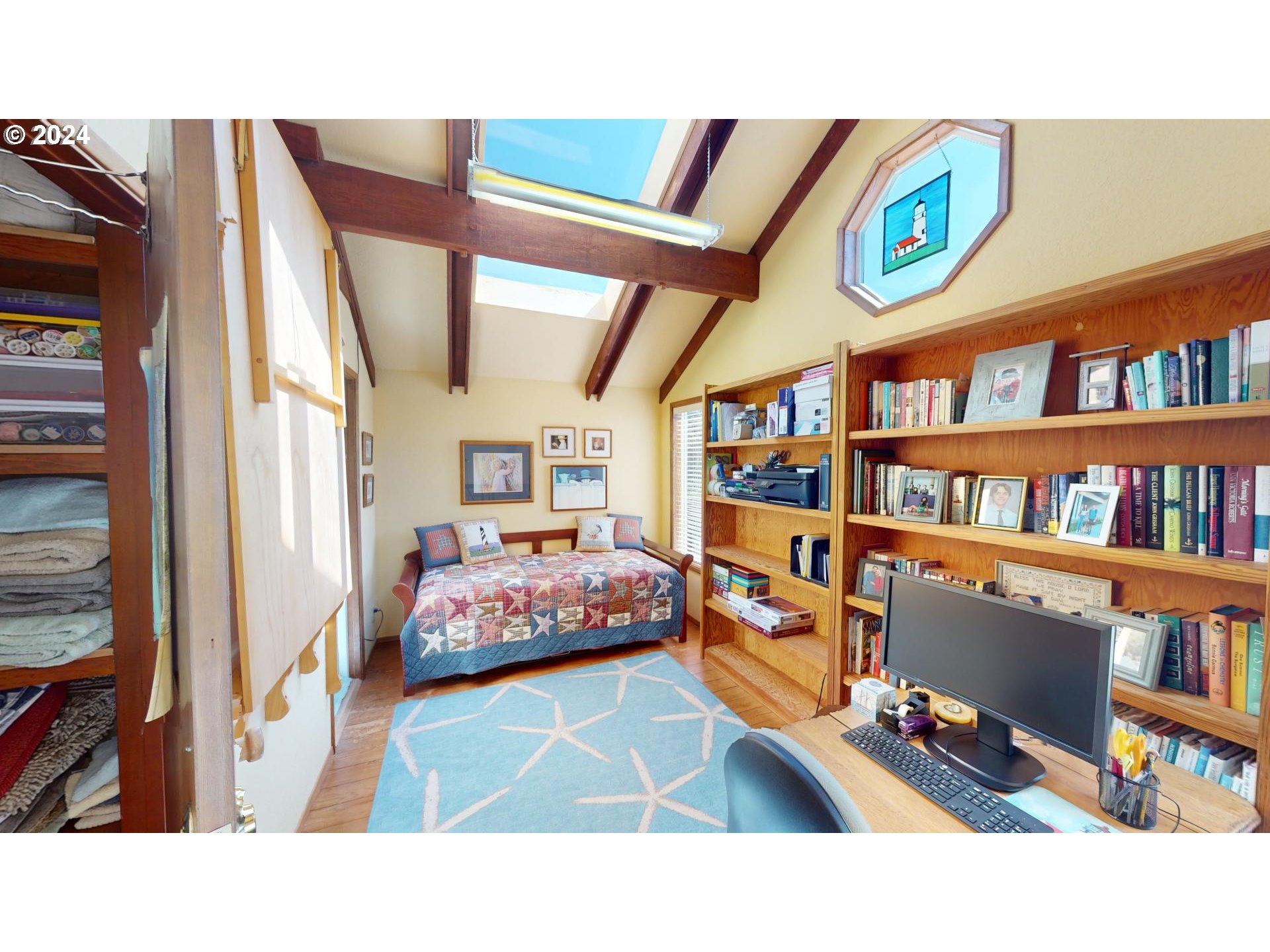 42512 Gull Road Port Orford, OR 97465 - Photo 29 of 41 a living room with furniture and a book shelf