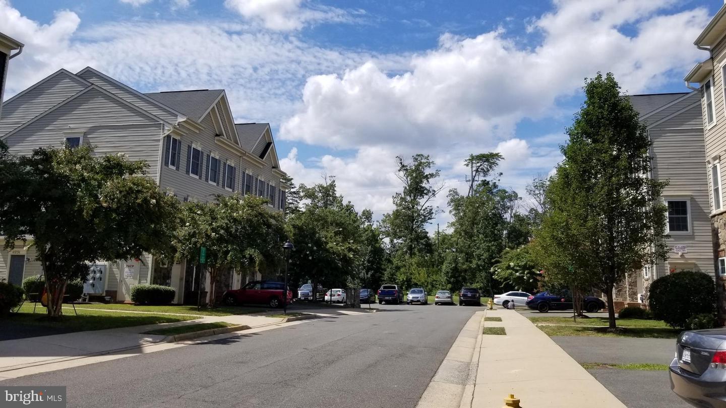 11224 Wortham Crest Circle Manassas, VA 20109 - Photo 3 of 3 a view of a parked cars in front of a building