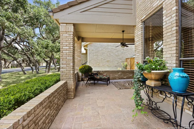 a backyard of a house with outdoor seating