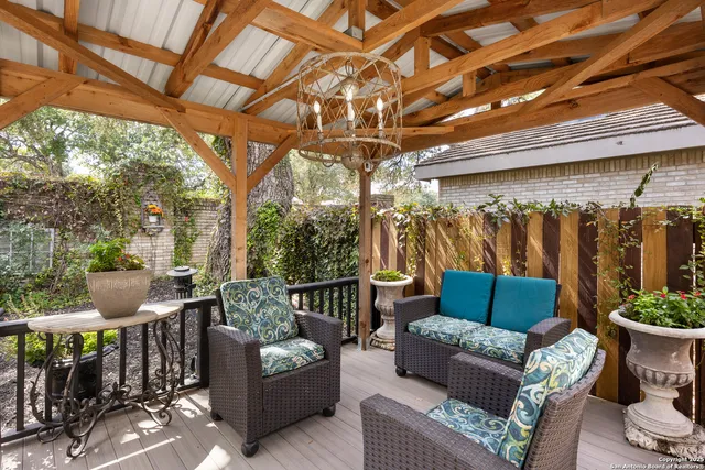 a outdoor living space with furniture and a fireplace