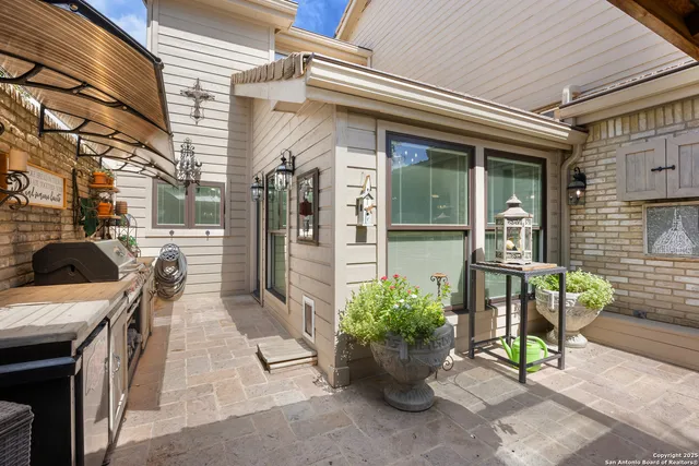 a view of a patio with a table and chairs