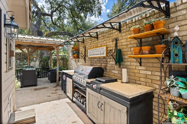 a view of a wooden bench sitting in backyard