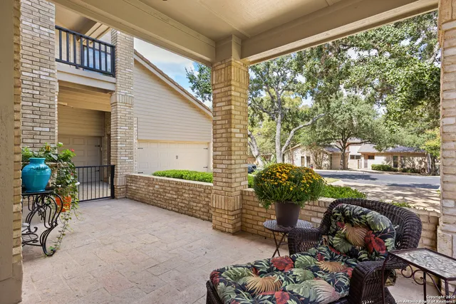 a view of a chairs and table in backyard