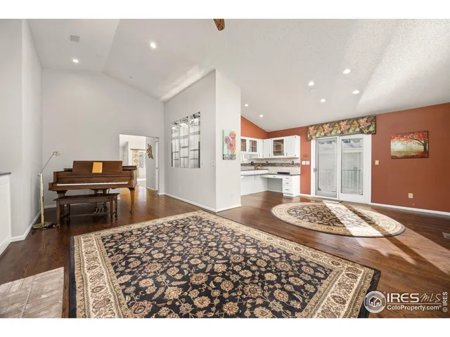 a bedroom with furniture and a wooden floor