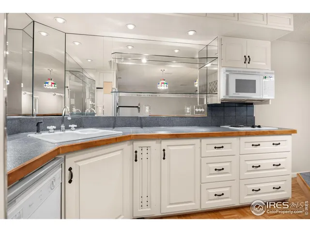 a bathroom with a sink a vanity and a mirror