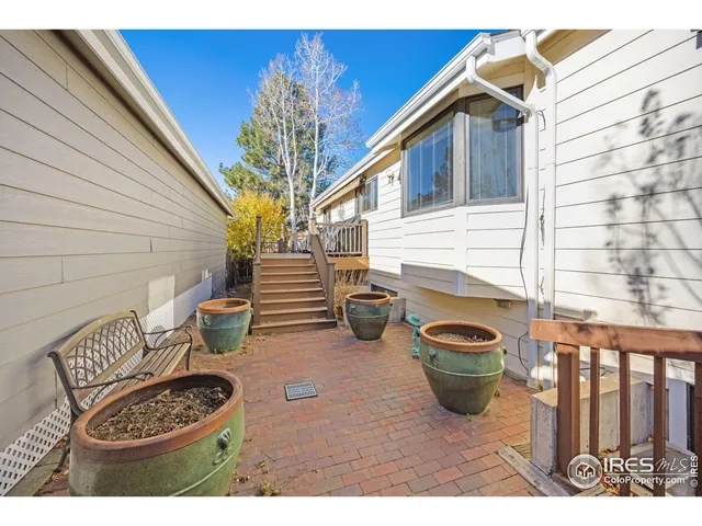 a view of a chairs and table in a patio