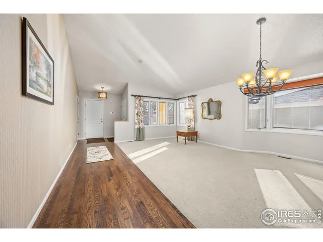 a view of livingroom with furniture chandelier
