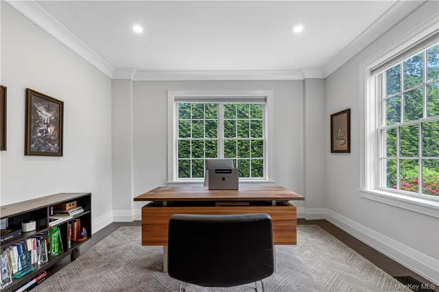 a room with furniture and large window