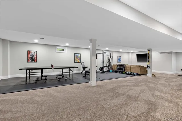 a view of a livingroom with furniture and a window