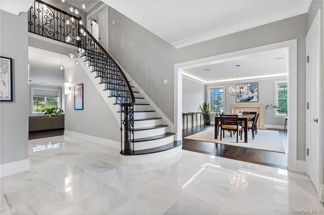 a view of livingroom and dining room with stairs