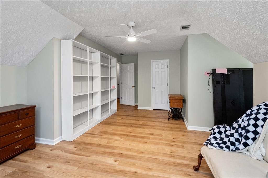 405 Ridgemont Drive Fayetteville, GA 30215 - Photo 26 of 43 a bedroom with a bed and cabinets